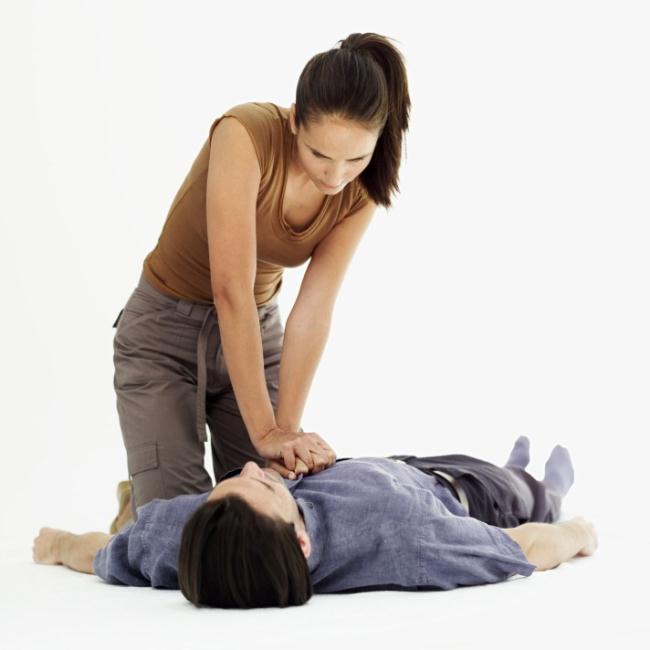 woman doing CPR